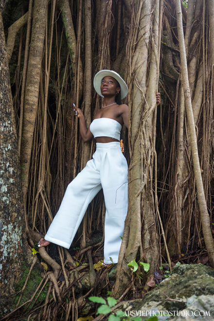 travel blogger posing in white outfit