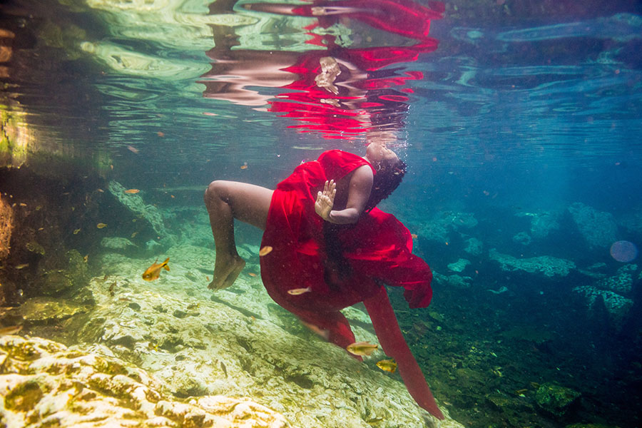 cenote underwater photography red dress