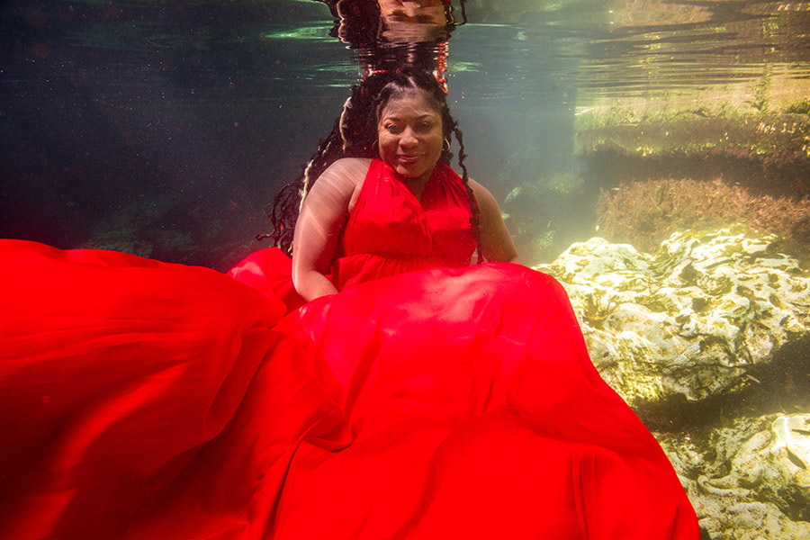 red flying dress underwater photoshoot