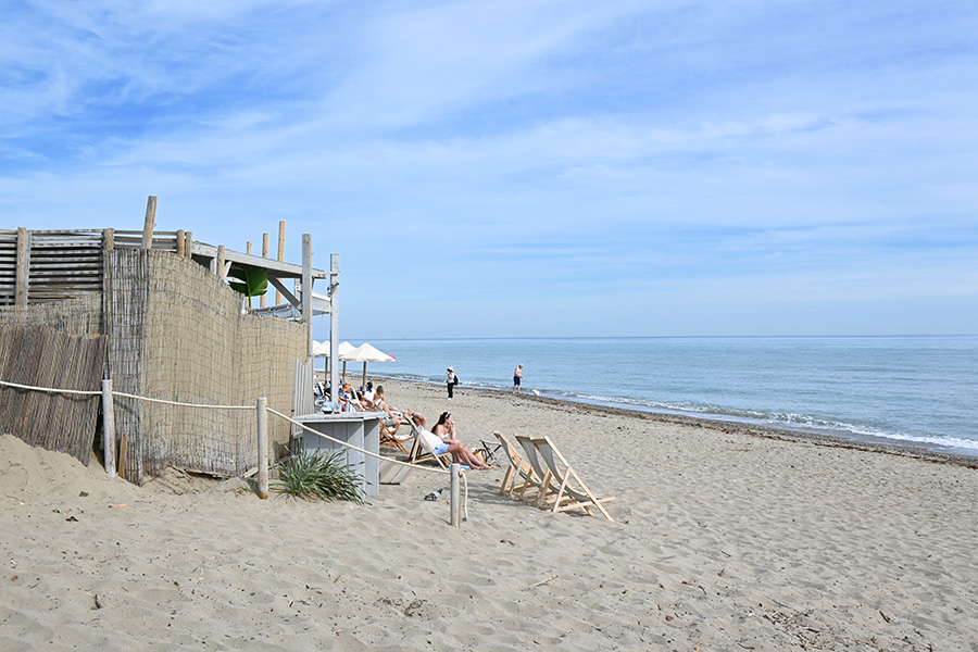 Relaxing-at-one-of-Spain-best-beaches-Real-de-la-Zaragoza-with-ocean-views-and-beach-chairs